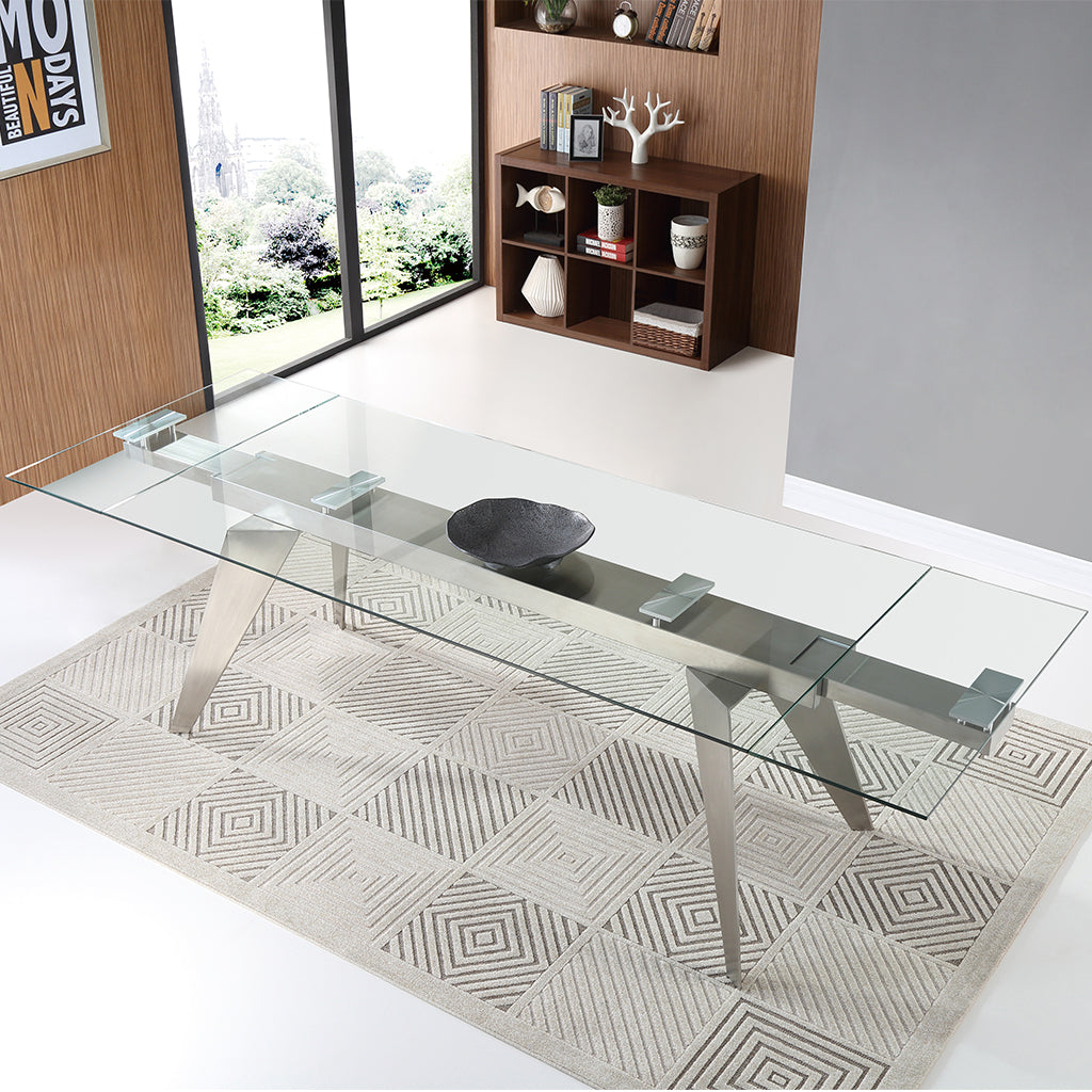 Solid Glass Table, Rectangular, Tempered Glass Top, Stainless Steel Mechanism, Stainless Steel Legs, DT1427 Brand: Whiteline Modern Living; Size: 79inW x 40inD x 31inH Extended: 110inW x 40inD x 31inH; Weight: 301lb; Shape: Rectangular Material: Top: 1/2" Tempered Clear Glass; Mechanism: Stainless Steel; Legs: Stainless Steel Seating Capacity: Seats 6-8 people; Color: Stainless Steel Color