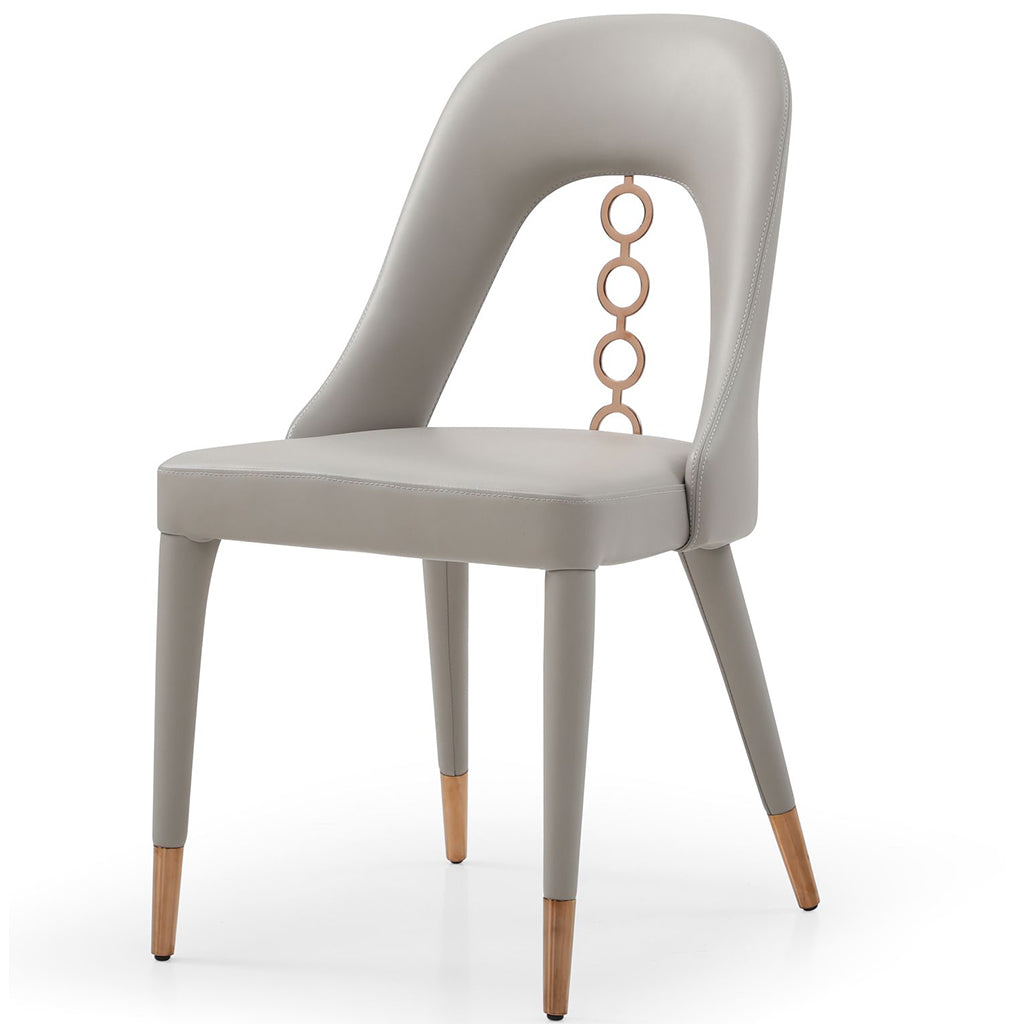 Whiteline Modern Living Liza Dining Chair set featuring sleek faux leather upholstery and detailed ornaments on the back