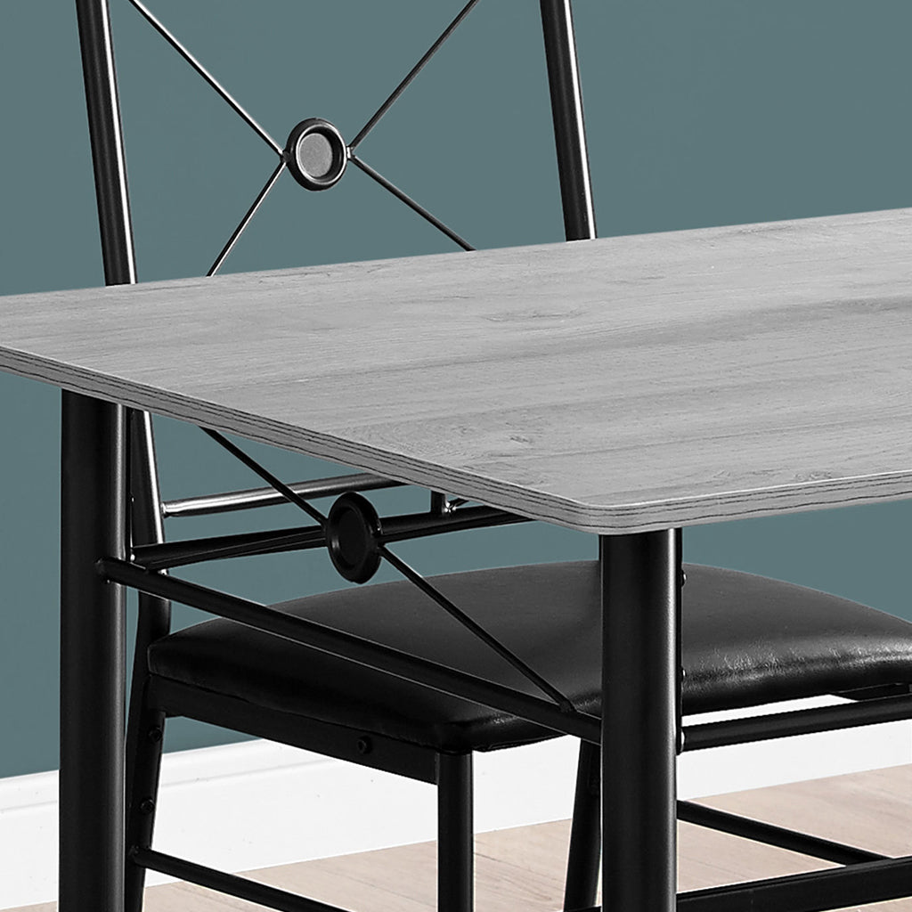 Black and Gray Dining Set, Rectangular Table & 4 Chairs, MDF & Metal Base, 332569 Brand: Homeroots, Table Size: 43inW x 28inD x 30inH, Chair Size: 16.5inW x 17inD x 36inH, Seat Height: 19in, Table Shape: Rectangular, Material: MDF & Metal Base, Faux Leather Seat With Metal Base Chairs , Seating Capacity: Seats 4, Color: Black & Gray