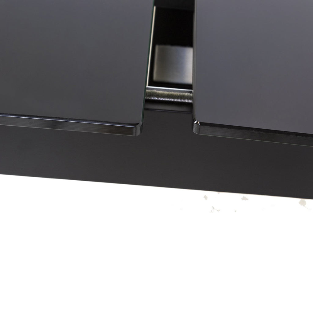 Maxima House Finezja Dining Table with a black extendable design and tempered glass top, offering modern elegance and functionality.