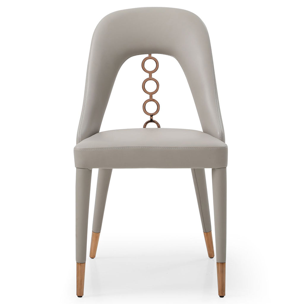 Whiteline Modern Living Liza Dining Chair set featuring sleek faux leather upholstery and detailed ornaments on the back