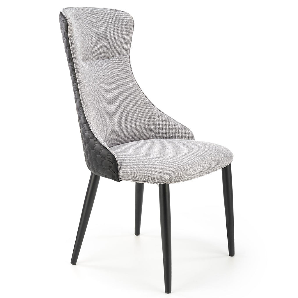 Gray and black dining chairs with fabric and faux leather upholstery and powder-coated steel legs.