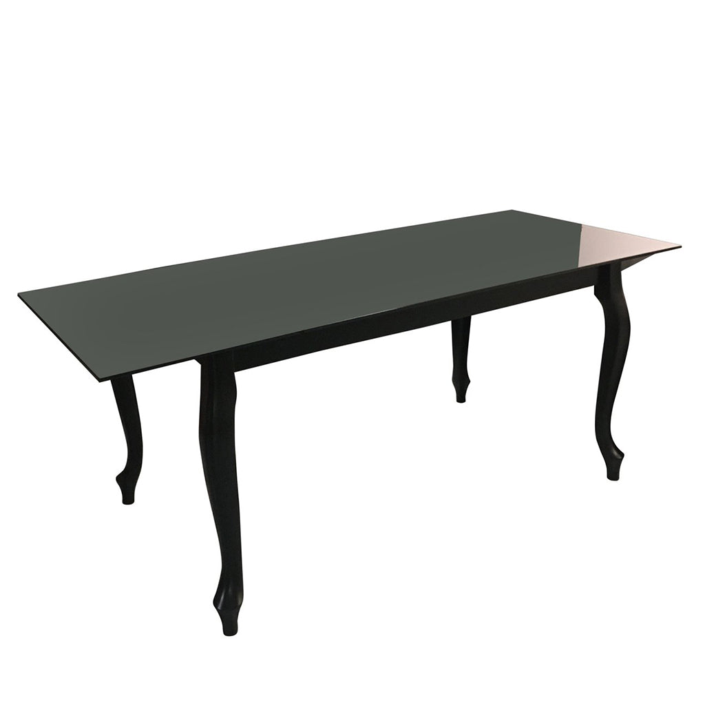 Maxima House Retro dining table with a glass top and curved beech wood legs.