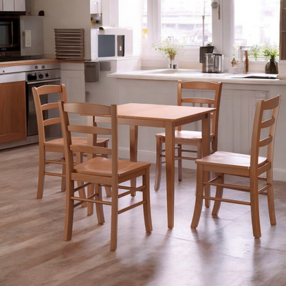 Square oak wood dining table with shaker legs and a light oak finish, accommodating up to four people.