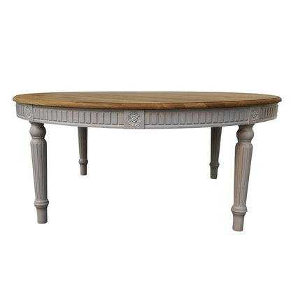 Maxima House Badi carved wood dining table with intricate detailing and buttermilk white legs, showcasing classic elegance.