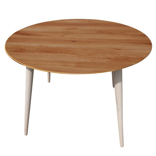 Maxima House Badi Dining Table with classic wood carvings and buttermilk white legs.