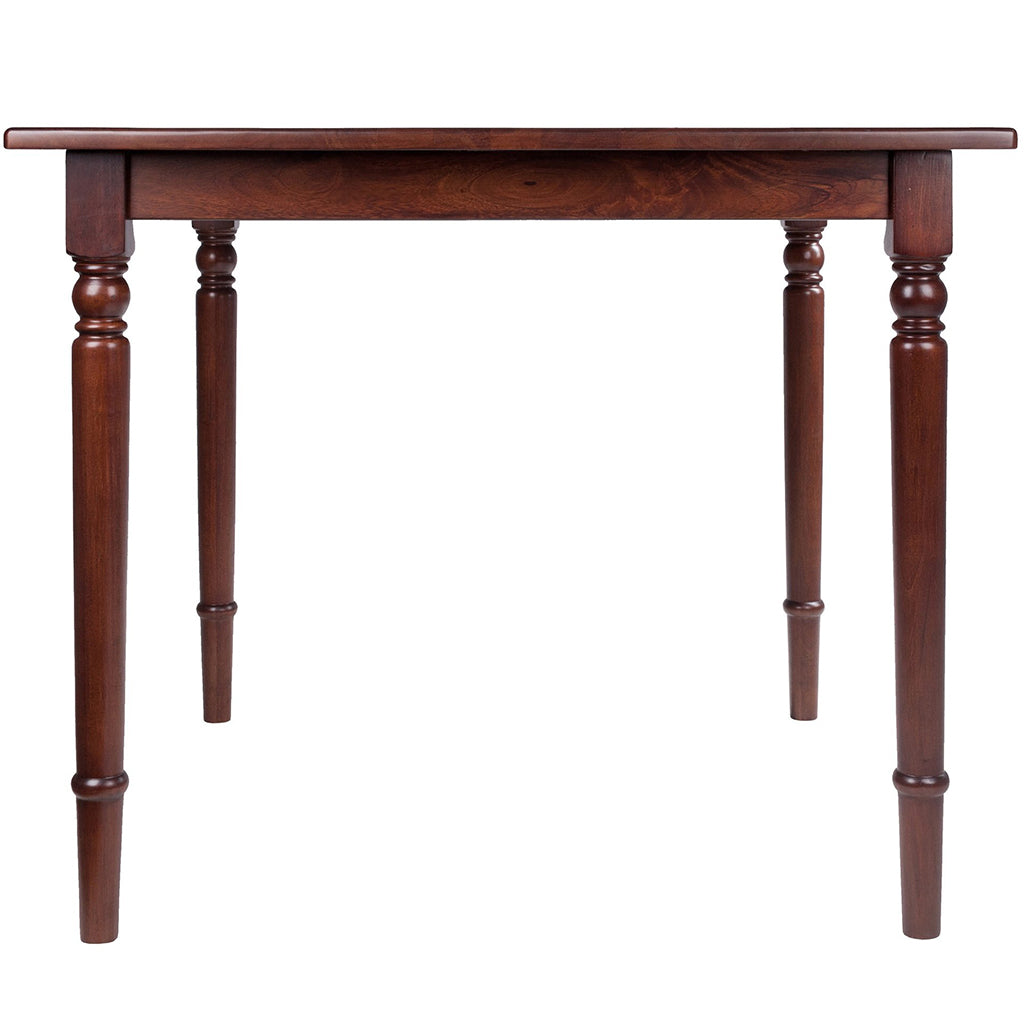 Square walnut wood dining table with turned legs and rounded corners, perfect for small dining areas.