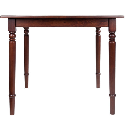 Square walnut wood dining table with turned legs and rounded corners, perfect for small dining areas.