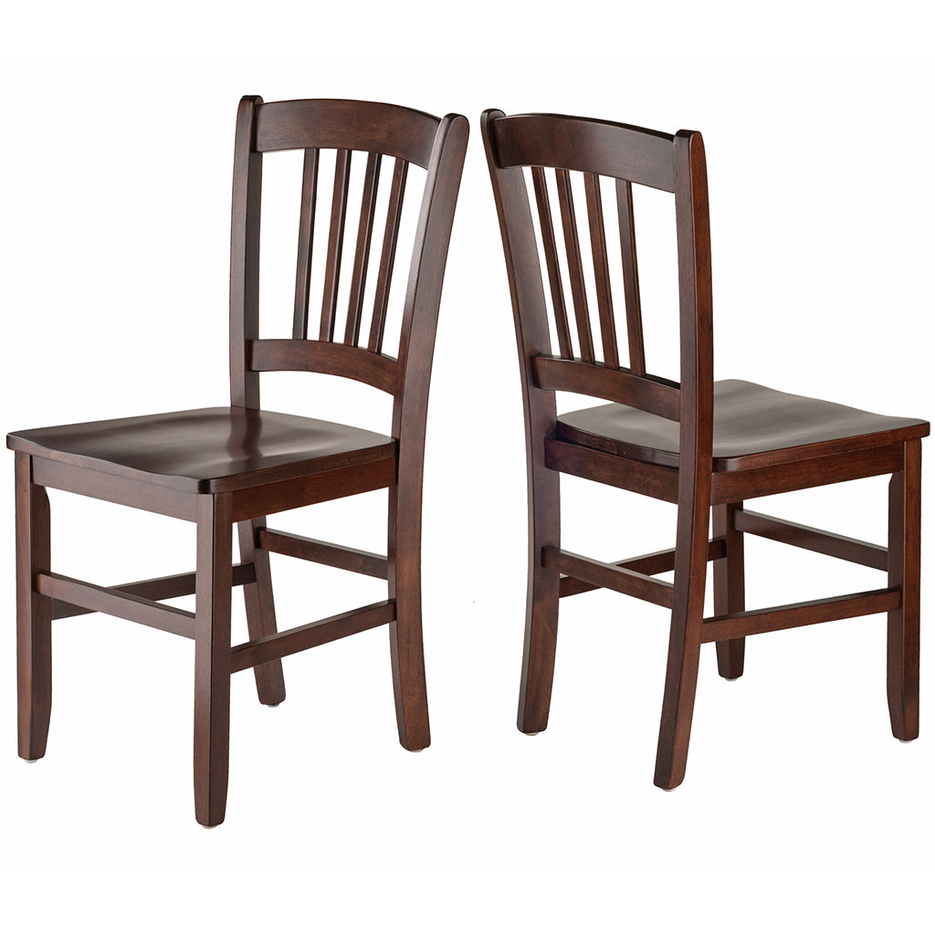 Set of two solid walnut wood dining chairs with contoured seats and gracefully curved backs, featuring a rich walnut finish.