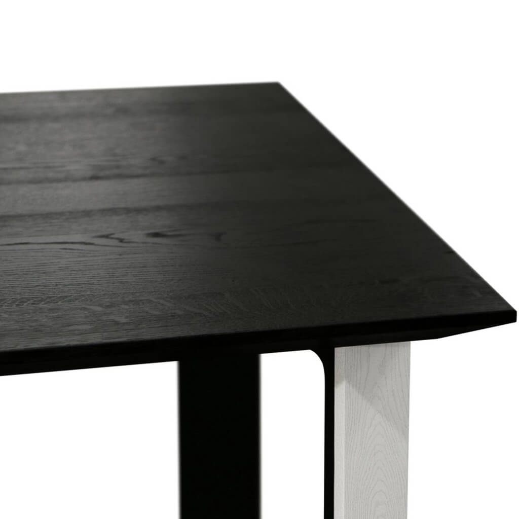 Maxima House Kasako-BW Dining Table featuring a black tabletop and white legs, showcasing a modern and elegant design.