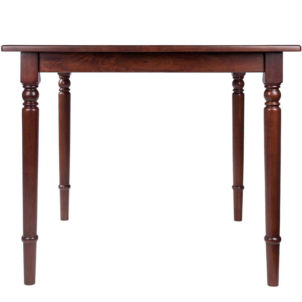 Square walnut wood dining table with turned legs and rounded corners, perfect for small dining areas.