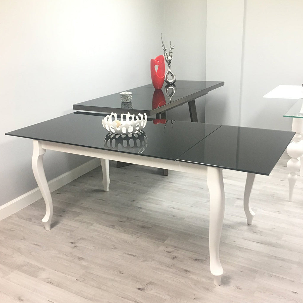 Maxima House Retro Glass Top Dining Table with white curved legs and beech wood base.