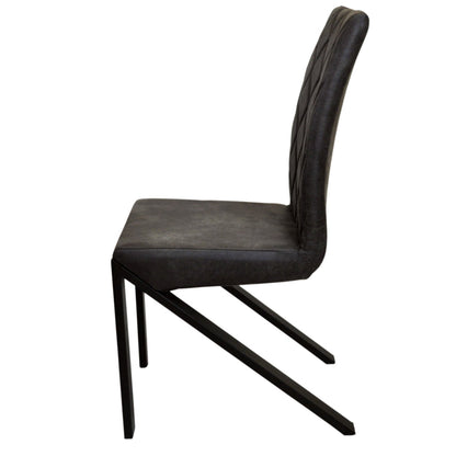 Leather lounge chairs with foam-padded seats and uniquely shaped metal legs