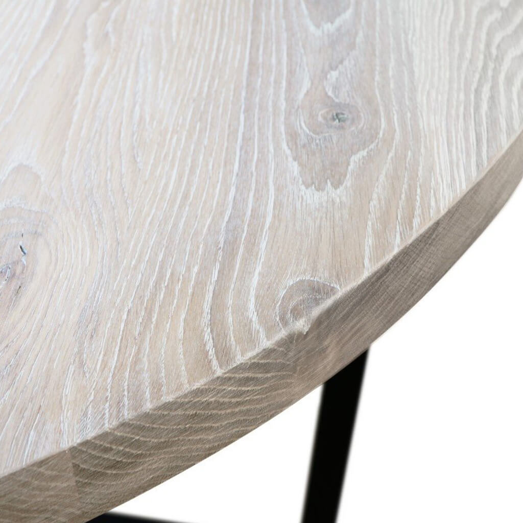 Maxima House Rounda U2 dining table with a modern oak wooden top and black metal base.