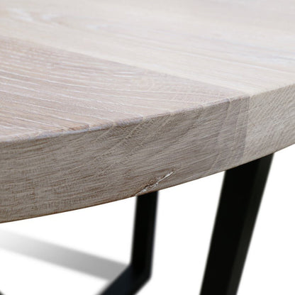 Maxima House Rounda U2 dining table with a modern oak wooden top and black metal base.