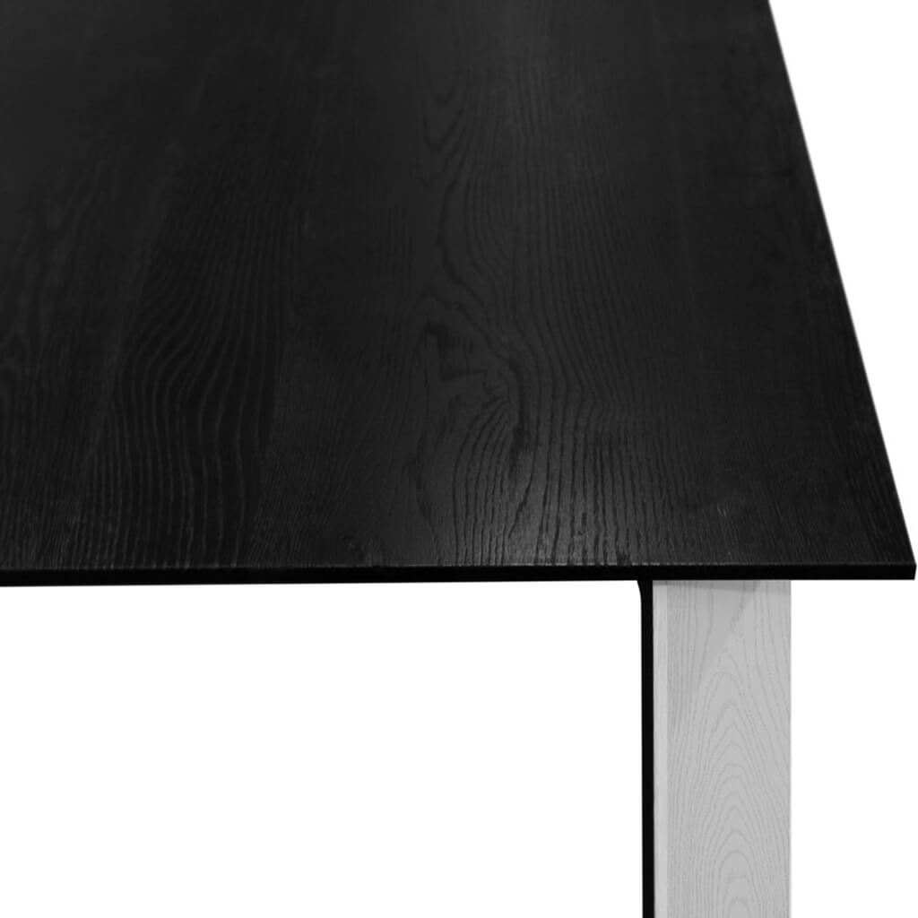 Maxima House Kasako-BW Dining Table featuring a black tabletop and white legs, showcasing a modern and elegant design.